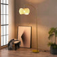 Brass Wave Arc Floor Lamp Handwoven Wicker Shade Aura